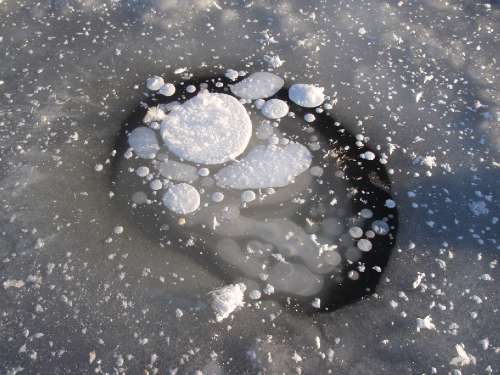 Methane bubbles in frozen Arctic pool