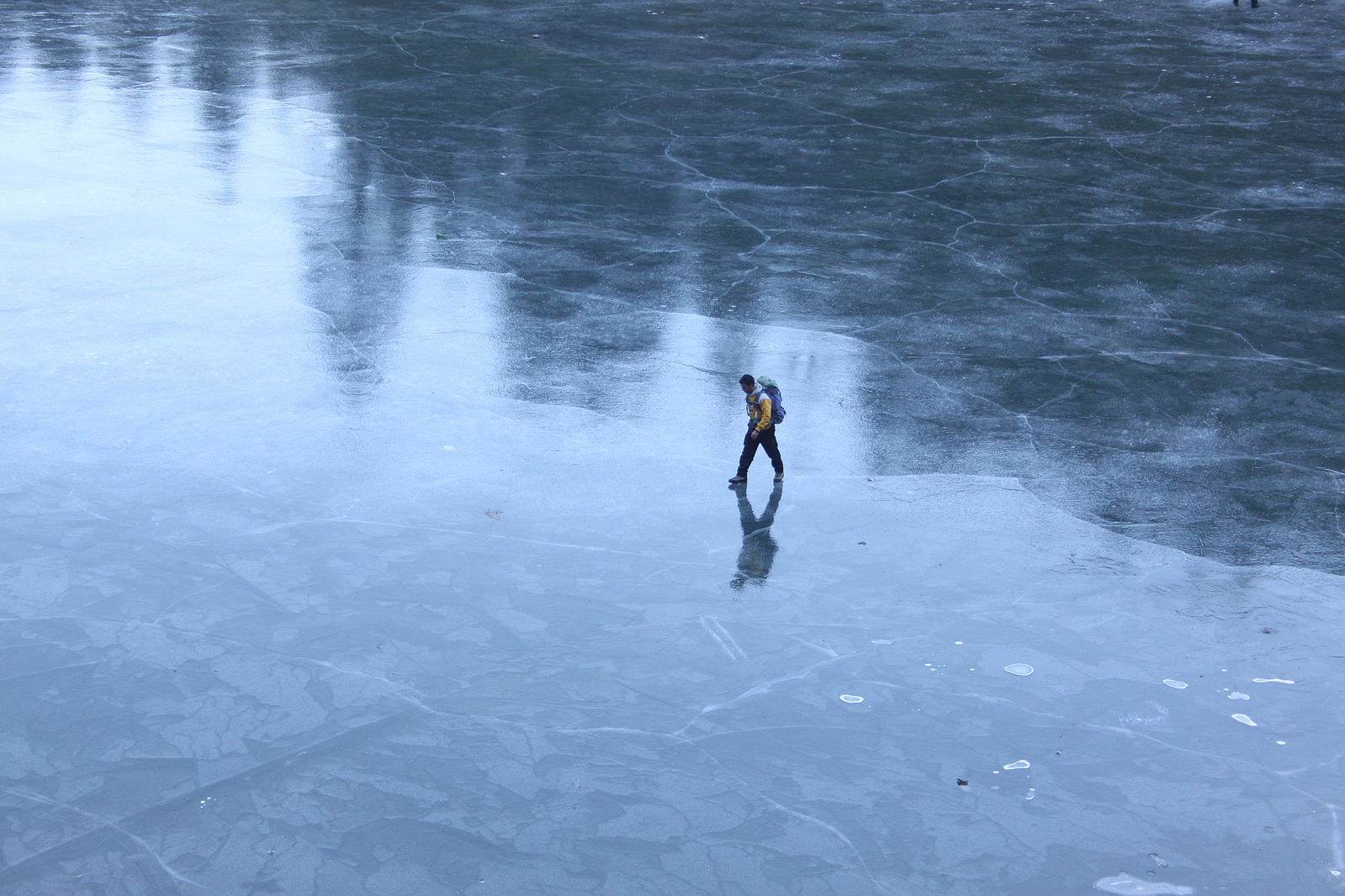 Wikimedia Commons Person walking on ice